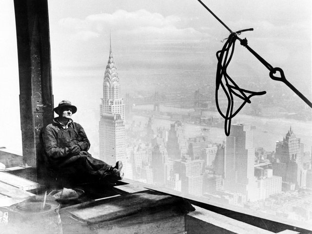 a-steel-worker-rests-on-the-86th-floor-of-the-new-empire-state-building-during-construction-in-new-york-city-september-24-1930.jpg