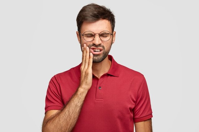 photo-caucasian-man-suffers-painful-toothache-has-rotten-tooth-needs-visit-dentist_273609-44088.jpg