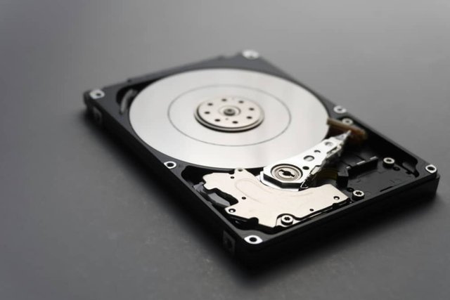 Close-up-of-hard-disks-internal-mechanism-hardware.-Soft-focus-at-middle-and-background.jpeg