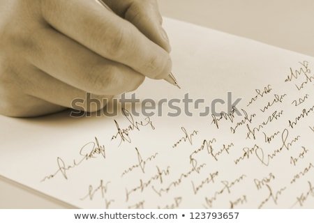 male-hand-writing-on-paper-450w-123793657.jpg