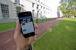 A_serviceman_accesses_social_media_channels_using_a_smart_phone,_outside_MOD_Main_Building_in_London_MOD_45156045.jpg