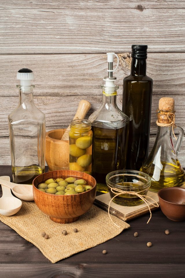 bottles-olive-oil-olives-table_23-2148364449.jpg