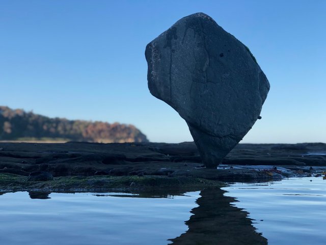 Upside down rock balancing