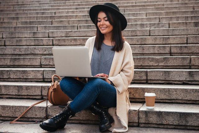 portrait-smiling-pretty-woman-using-laptop-computer1.jpg