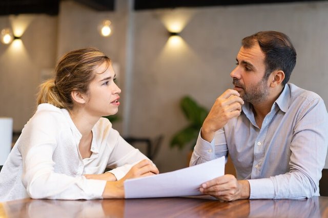 serious-business-professional-discussing-report_1262-18032.jpg
