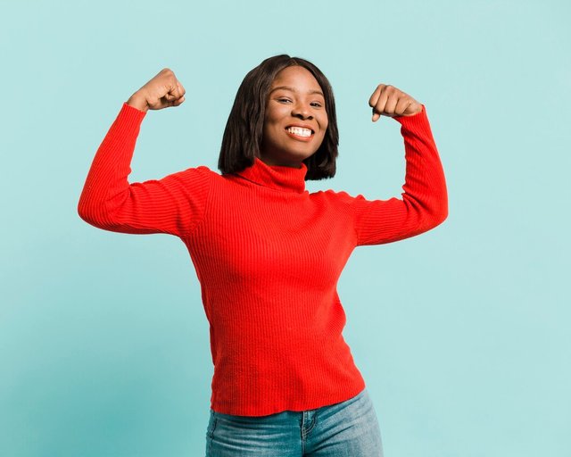 front-view-strong-woman-studio_23-2148410814.jpg