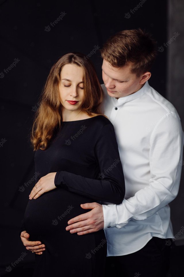 man-white-shirt-female-black-dress-pregnancy-photo_1328-5368.jpg