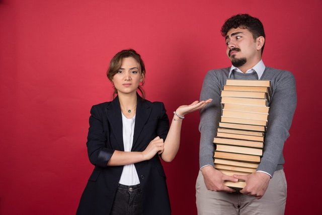 young-woman-getting-angry-man-who-carries-bunch-books_114579-58577.jpg