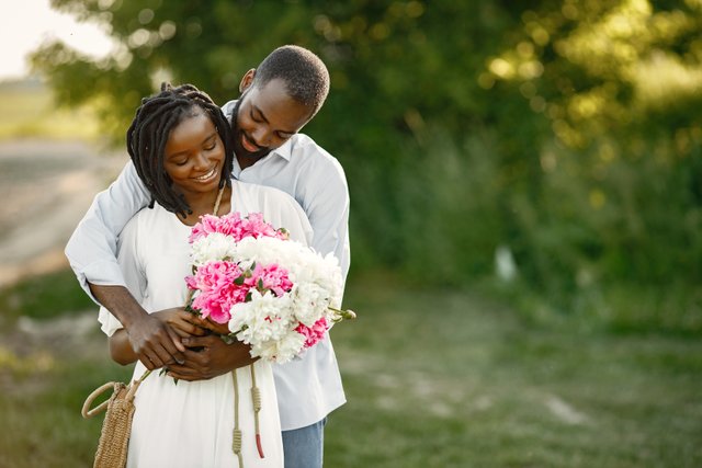 young-african-couple-romantic-embrace-field-young-lovers-field-with-flowers.jpg