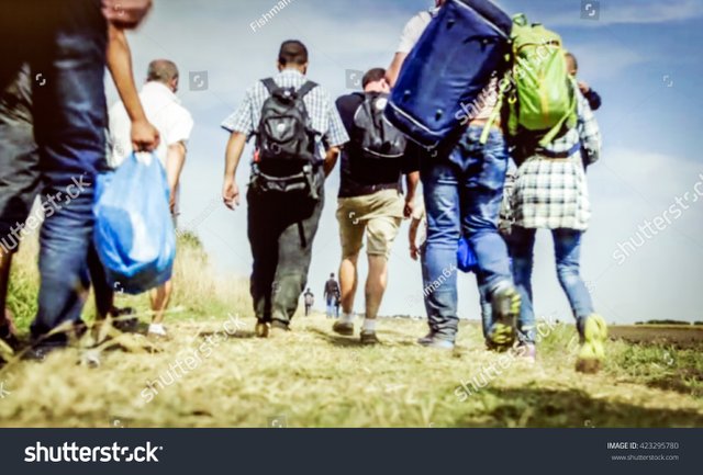 stock-photo-the-refugees-migrate-to-europe-blurred-bokeh-background-defocused-423295780.jpg