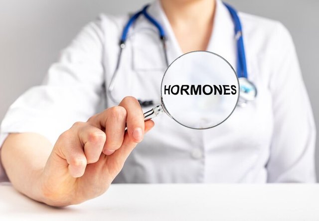 doctor-studying-hormones-concept-magnifier-with-word_361816-6681.jpg
