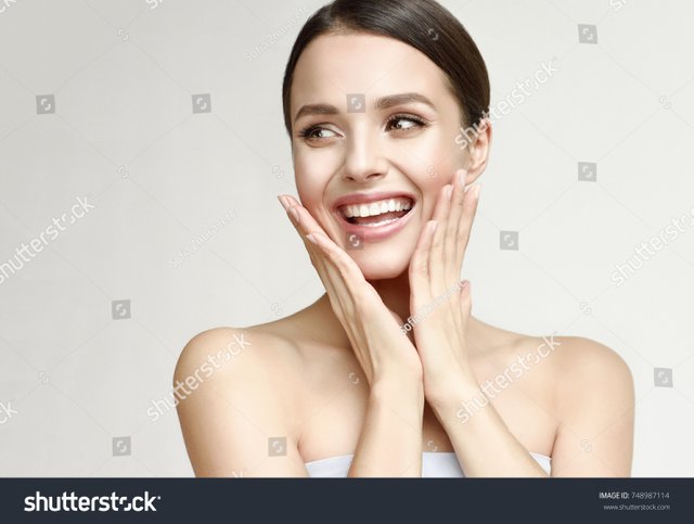 stock-photo-happy-beautiful-girl-holding-her-cheeks-with-a-laugh-looking-to-the-side-expressive-facial-748987114.jpg