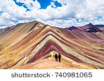 stock-photo-tourists-couple-stand-and-look-afar-at-rainbow-mountains-cusco-peru-740981065.jpg