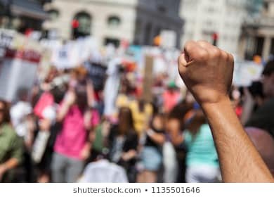 raised-fist-protestor-political-demonstration-260nw-1135501646.jpg