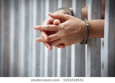 close-prisoner-hands-jail-background-260nw-1031018551.jpg