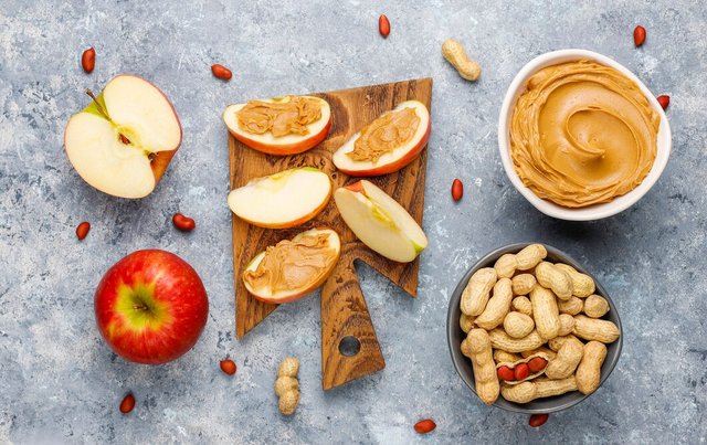 homemade-peanut-butter-with-peanuts-grey-concrete-table-top-view_114579-7067.jpg