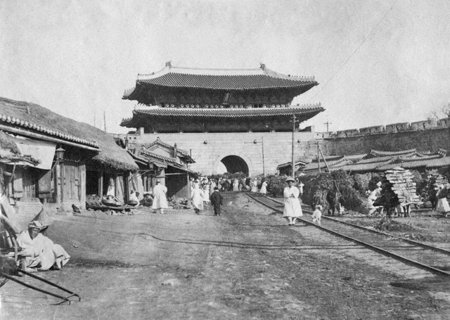 Namdaemun (Great South Gate in Seoul) is shown here with the tramtrails, which was instituted as a public transportion system in May 1899. ca. 1904b.jpg