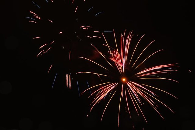 free-photo-of-fireworks-in-the-dark-sky-with-many-colors.jpeg