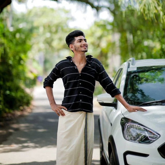 Model-wearing-lungi-and-posing-near-the-car-438429-pixahive.jpg