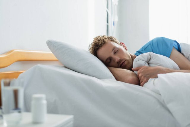 stock-photo-curly-patient-sleeping-hospital-bed.jpg