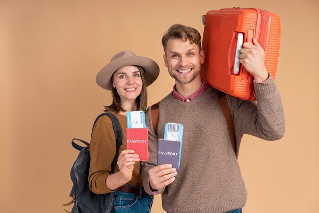 smiley-couple-ready-traveling-with-luggage_23-2149205289.jpg