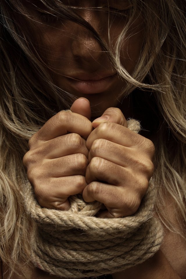 close-up-photo-of-woman-with-her-hands-tied-with-rope-1435441.jpg