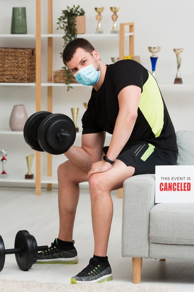 man-training-while-wearing-medical-mask_23-2148596976.jpg