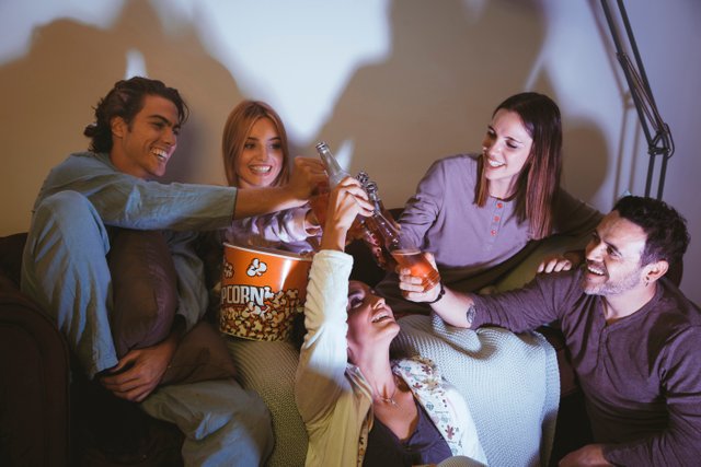 four-laughing-friends-watching-movie.jpg