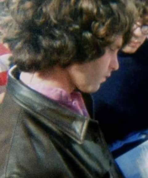 Jim Morrison reading Who concert program, Singer Bowl, 8-2-1968.jpg