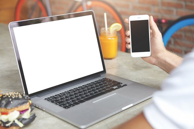 man-checking-e-mail-using-high-speed-internet-connection-electronic-devices-male-with-smart-phone-his-hand-sitting-front-open-laptop_273609-1409.jpg