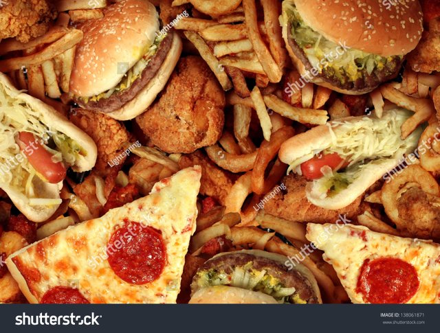 stock-photo-fast-food-concept-with-greasy-fried-restaurant-take-out-as-onion-rings-burger-and-hot-dogs-with-138061871.jpg