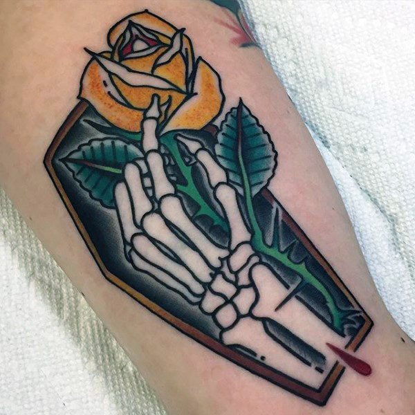 retro-old-school-guys-skeleton-hand-coffin-with-yellow-rose-flower-arm-tattoo.jpg