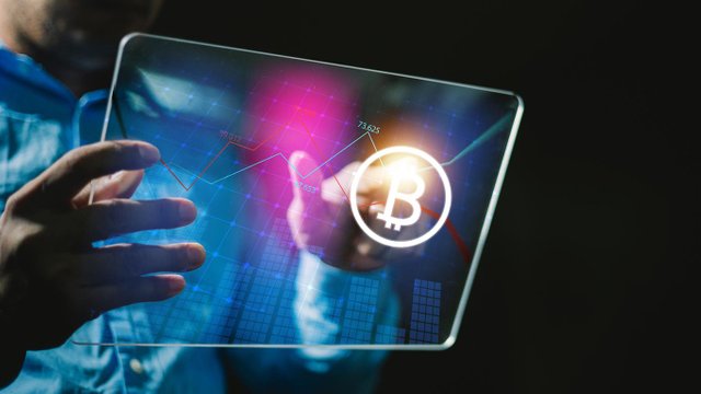 1920-businessman-using-tablet-to-connected-on-global-network-and-gold-bitcoin-coin-in-fire-and-growth-of-business-graph-financial-stock-market-cryptocurrency-and-investment.jpg