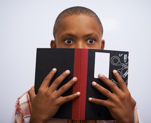 student-classroom-hide-face-with-book-read-front-classmates-shy-nervous-elementary-school-boy-prepared-oral-with-workbook-childhood-development-academic-education_590464-265915.jpg