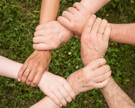 People holding hands in show of trust.jpeg