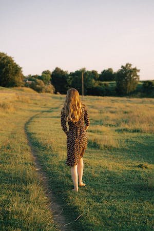 free-photo-of-woman-walking-on-a-field-in-summer.jpeg