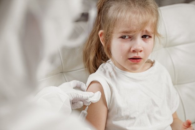 little-girl-cries-her-hurt-scared-injection-illness-vaccination-call-doctor-home-pandemic_420054-657.jpg