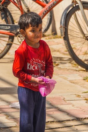 free-photo-of-cute-poor-child-on-city-street.jpeg