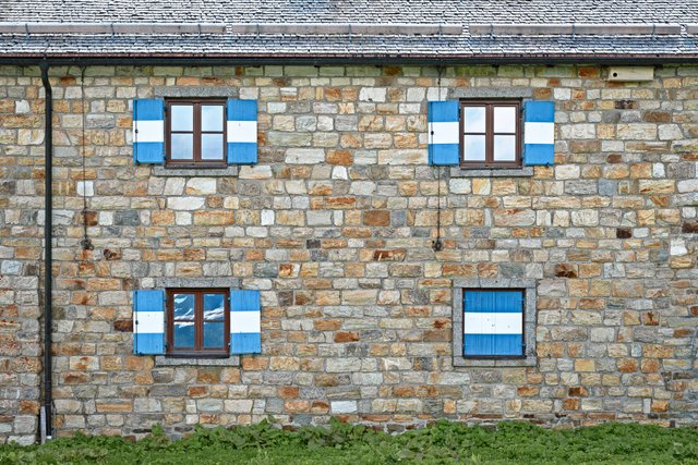 Four windows with blinds