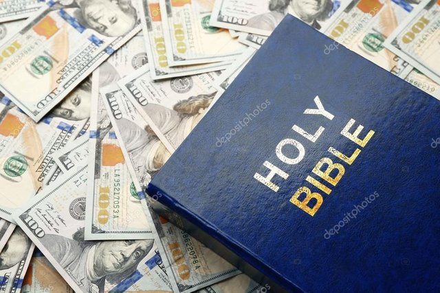 depositphotos_105081722-stock-photo-holy-bible-on-money-background.jpg