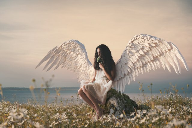 full-shot-woman-with-wings-outdoors.jpg