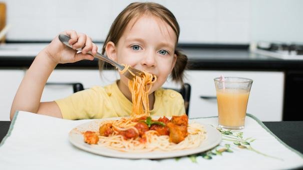 child-eating-pasta-Dollarphotoclub_70859969.jpg