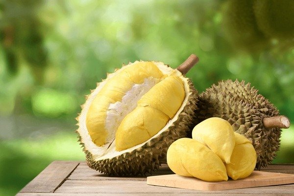 durian-fruit-on-wooden-table-600nw-2298368589.jpg