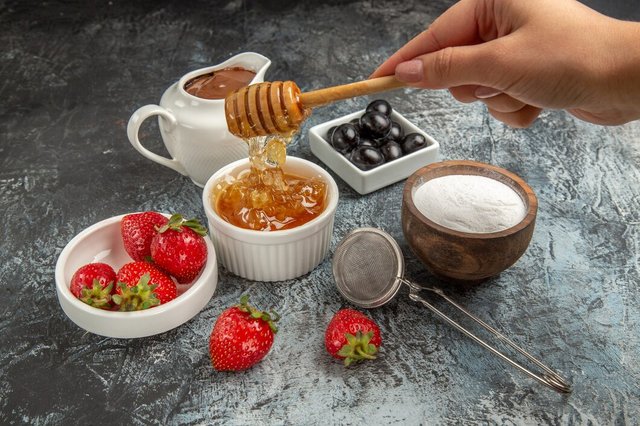 front-view-fresh-strawberries-with-honey-dark-surface-fruit-sweet-jelly-food_140725-81944.jpg