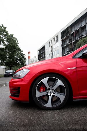 free-photo-of-side-view-of-a-red-volkswagen-golf-vii-on-a-street.jpeg