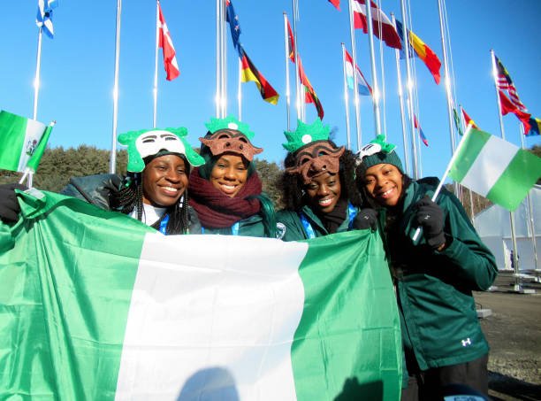 nigerian-delegation-pose-for-photographs-with-the-national-flag-the-picture-id915119712.jpeg