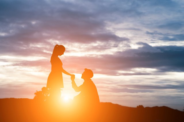 silhouette-man-ask-woman-marry-mountain-background.jpg