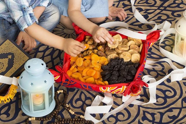 muslim-kids-eating-iftar-breakfast-holy-month-ramadan-muslim-kids-eating-iftar-breakfast-ramadan-food-dates-apricots-figs-116819545.jpg