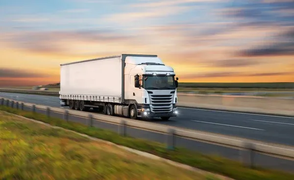 depositphotos_291567052-stock-photo-truck-with-container-on-road.jpg