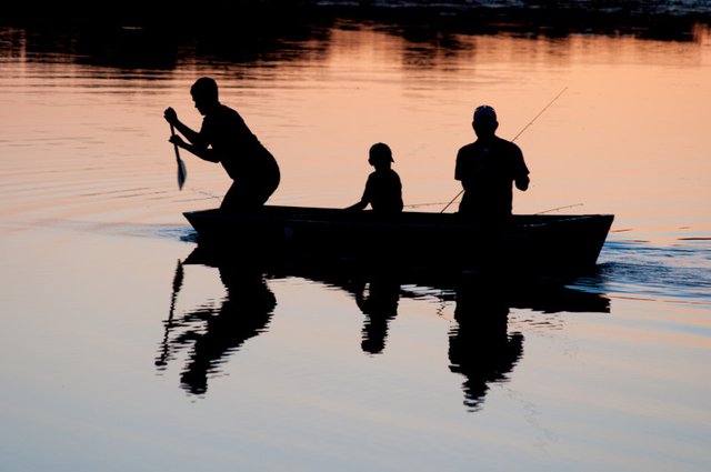 People fishing in water